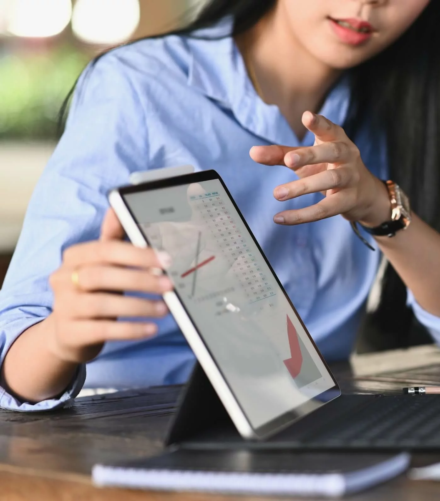 Consultant explaining data on a tablet screen